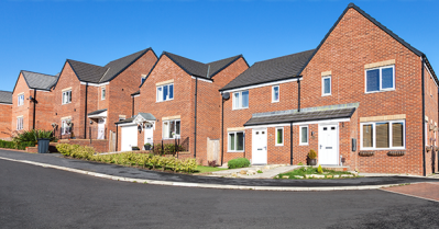 New build survey for buying off plan homes - from SAM Conveyancing. A red-brick new build residential estate on a sunny day.