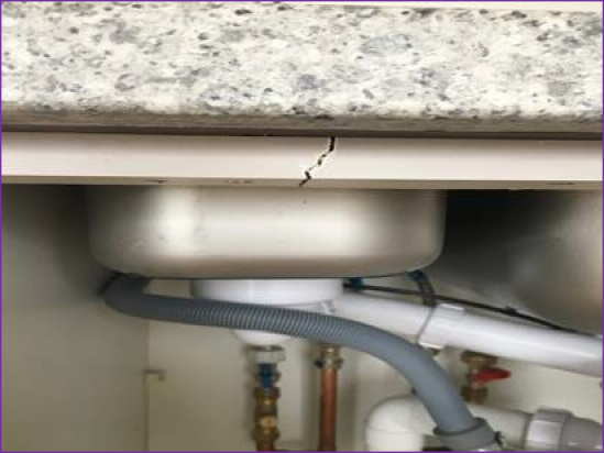 Snagging Survey - Cracked Carcass under Kitchen Sink - new build snagging surveys