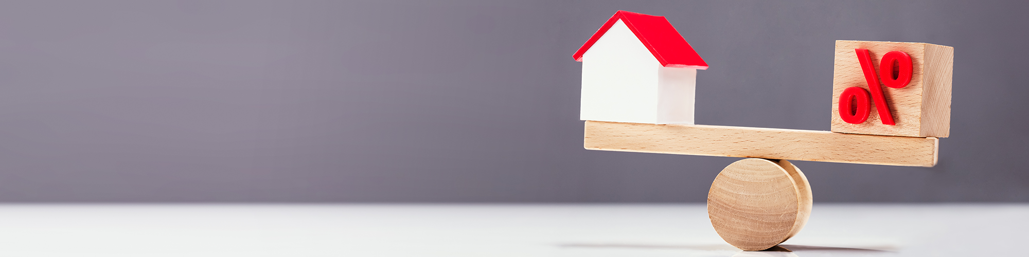 a see-saw representing unequal shares in a property. Change from Joint Tenants to Tenants in Common with SAM Conveyancing