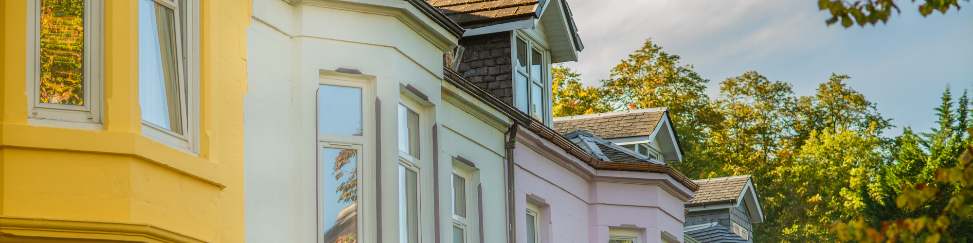Contractor Mortgages from SAM Conveyancing. A leafy urban Victorian terrace of bright painted houses