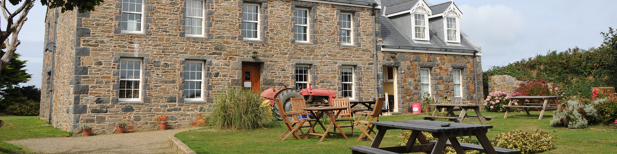 Pre-Georgian farmhouse building in the countryside. SAM Conveyancing's guide to farm building surveys