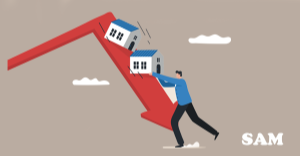 A man holding up two model houses which are sliding down a big red downwards pointing arrow. SAM Conveyancing's guide on 10 things that cause property values to decrease & how to fix them