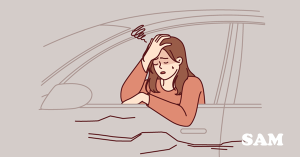 A woman in a car that has stalled like the housing market in May 2026