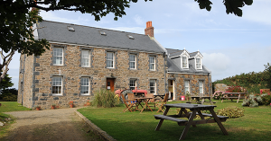 Pre-Georgian farmhouse building in the countryside. SAM Conveyancing's guide to farm building surveys