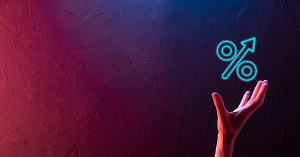 A hand reaches up to grasp a rising percentage symbol. SAM Conveyancing helps you answer: Should I Fix My Mortgage for 2 or 5 Years?