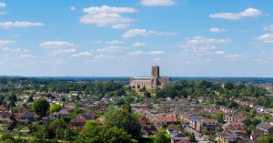 An aerial panorama of Guildford with blue skies. SAM Convayancing's Surrey housing market report An aerial panorama of Guildford with blue skies. SAM Convayancing's Surrey housing market report