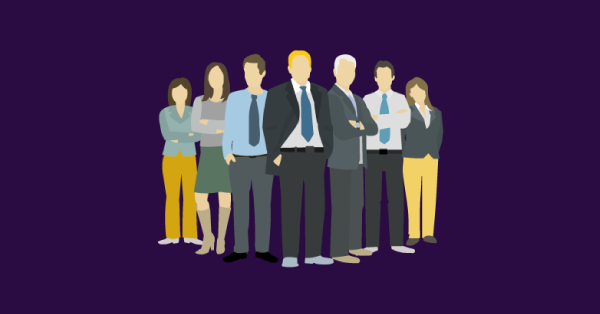 A group of business people stood in a line. SAM Conveyancing answers 'what is a deed of guarantee?'