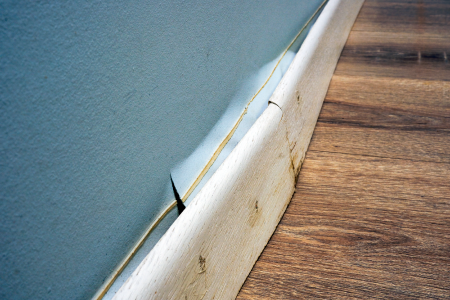 Blown out skirting boards caused by damp