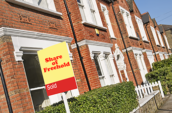 Estate Agent sign outside house signifying fast solution conveyancing gets your move completed more quickly