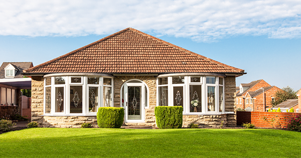 A bungalow with a neat back garden. SAM Conveyancing can help add value to your home, whether it's an en suite bathroom, installing solar panels, or a loft conversion