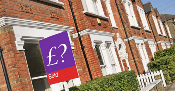 Independent Valuation Report - A Guide on Property Valuation Surveys from SAM Conveyancing. An estate agents sign outside of a terraced house.