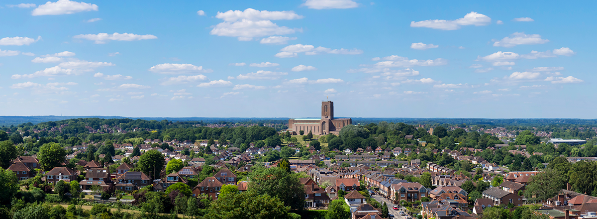 Aerial panorama of Surrey showing Guildford and the cathedral. SAM Conveyancing's report on the Surrey Housing Market